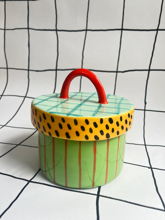 Colorful lidded container with patterned decoration
